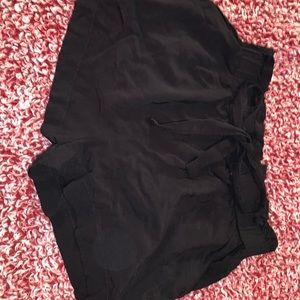 Black silk like shorts. With bow in the front size Large